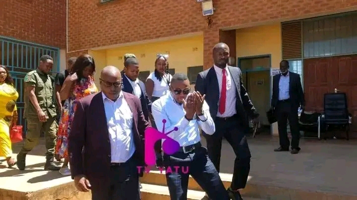 Elias Musyani cries for search warrant as police drag him by the belt into custody