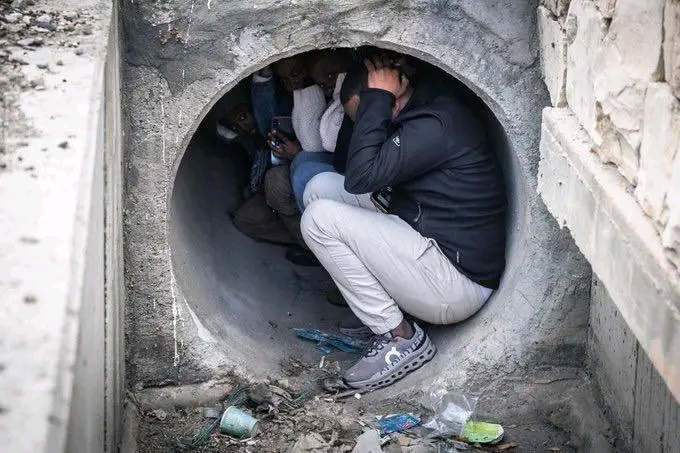 African migrants and other non-Jewish groups in Israel are being pushed into unsafe spaces, even hiding in tunnels during missile attacks, while Israelis access proper bomb shelters