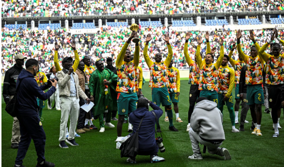 Senegal parade AFCON trophy at Stade De France