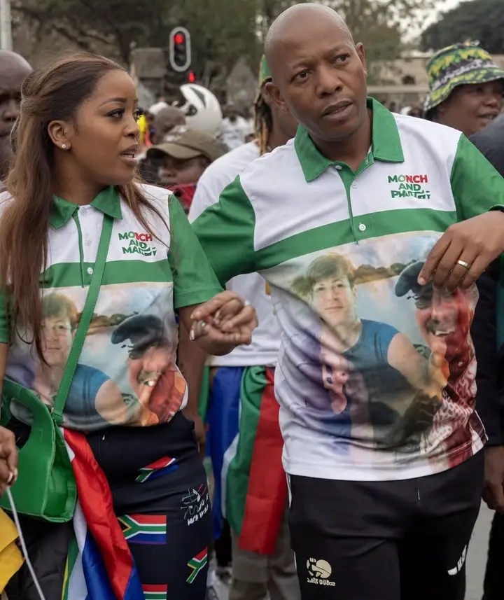 MARCH AND MARCH LEADER JACINTA NGOBESE-ZUMA AND HER HUSBAND WEAR T-SHIRTS HONOURING COUPLE ALLEGEDLY KILLED BY FOREIGN NATIONALS