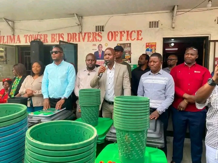 KULIMA TOWER BUS CHAIRMAN NICHOLAS BANDA DISTRIBUTES BINS TO KEEP KULIMA TOWER CLEAN